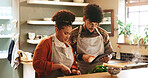 Couple, tablet and cooking in kitchen with search for recipe, video or guide for meal prep in home. People, man and woman with digital touchscreen, app or partner for food, nutrition or diet in house