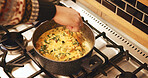 Hands, pot and cooking in home, soup and heat with ingredients, nutrition and food on stove in kitchen. Person, chef and meal prep for flavor, diet and above with vegetables, recipe and stir at house