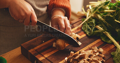 Buy stock photo Hands, mushroom and cutting board in kitchen, home and meal prep with knife, spinach and cooking healthy food. Person, chef and tools for organic produce, nutrition and diet for wellness at apartment