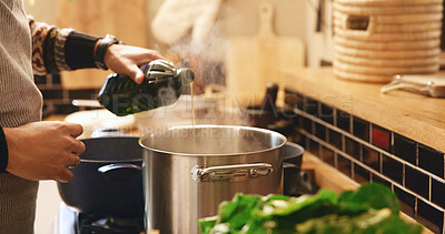 Buy stock photo Cooking, hands and olive oil with person in kitchen of home for flavor or meal preparation. Food, gas stove or pot and chef pouring liquid in apartment for diet, health cuisine or nutrition recipe