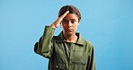 Girl, portrait and junior pilot with salute in studio for flight service, welcome or respect on a blue background. Female person, child or teenager with acknowledgement or recognition for air control