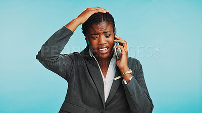 Buy stock photo Phone call, upset and black woman in studio, business and conversation on blue background. African person, consultant and model with cellphone, bad news and failure with mistake, stress or frustrated