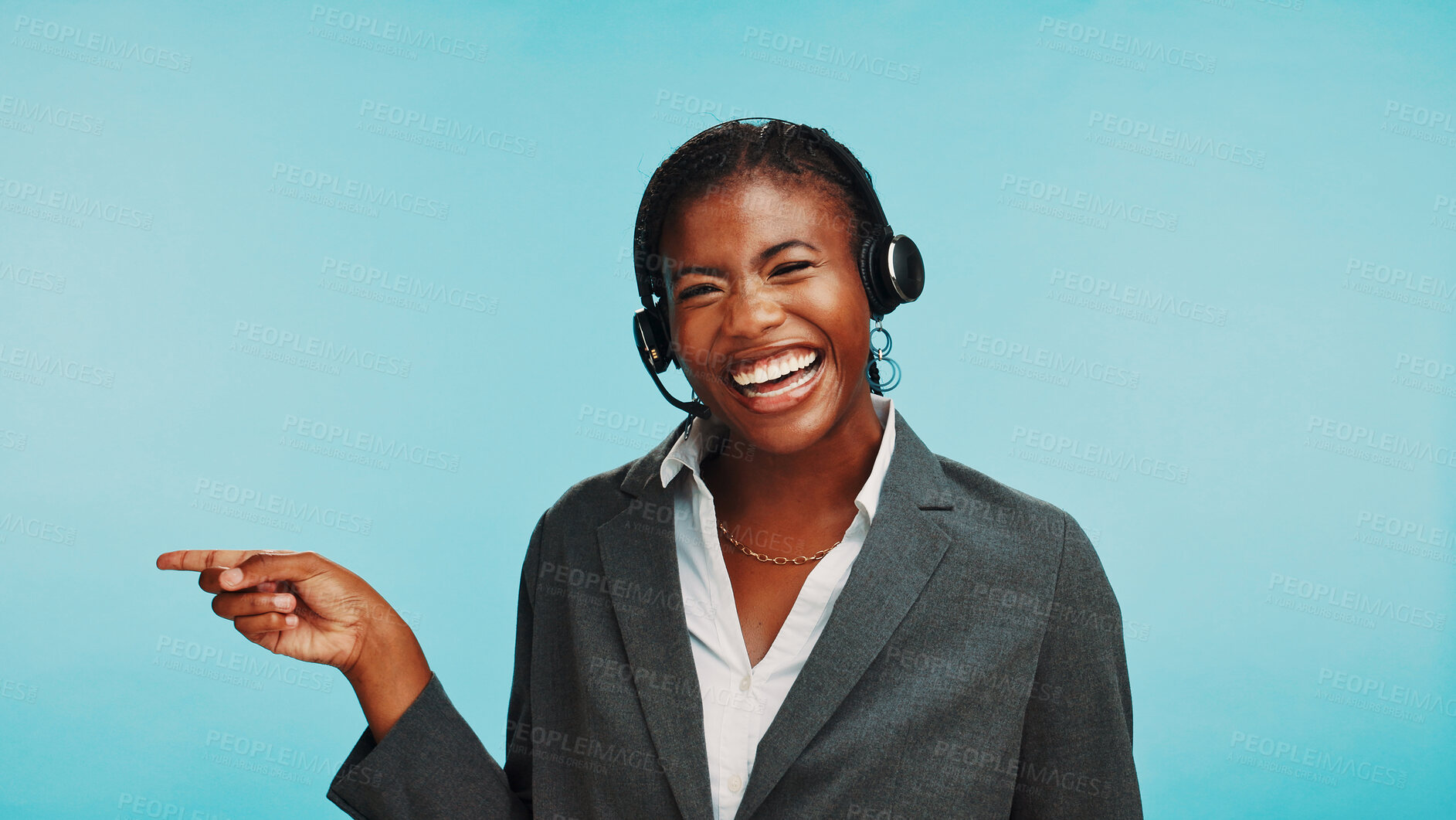 Buy stock photo Pointing, customer service and portrait of black woman in studio for announcement, online help and contact. Blue background, happy and person with headset for sales news, crm support and advice