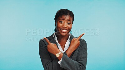Buy stock photo Portrait, business or black woman in studio, pointing or job opportunity on blue background. African person, model or employee with hand gesture, coming soon or about us with space, smile or branding