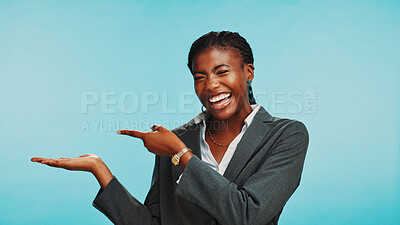 Buy stock photo Professional, advertising and black woman with pointing in studio for hiring opportunity and product placement. HR, laughing and mockup space with offer for job promotion or launch on blue background