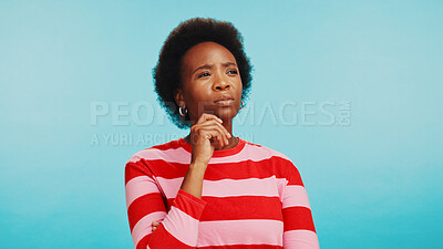 Buy stock photo Thinking, decision and black woman in studio for choice, selection and options on blue background. Mockup space, brainstorming and unsure person with ideas, solution and doubt for uncertainty