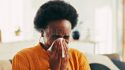 Buy stock photo Blowing nose, sick and black woman in home with flu, cold or allergies with viral infection. Illness, tissue and African female person with sneeze for sinusitis, hayfever or virus in living room.