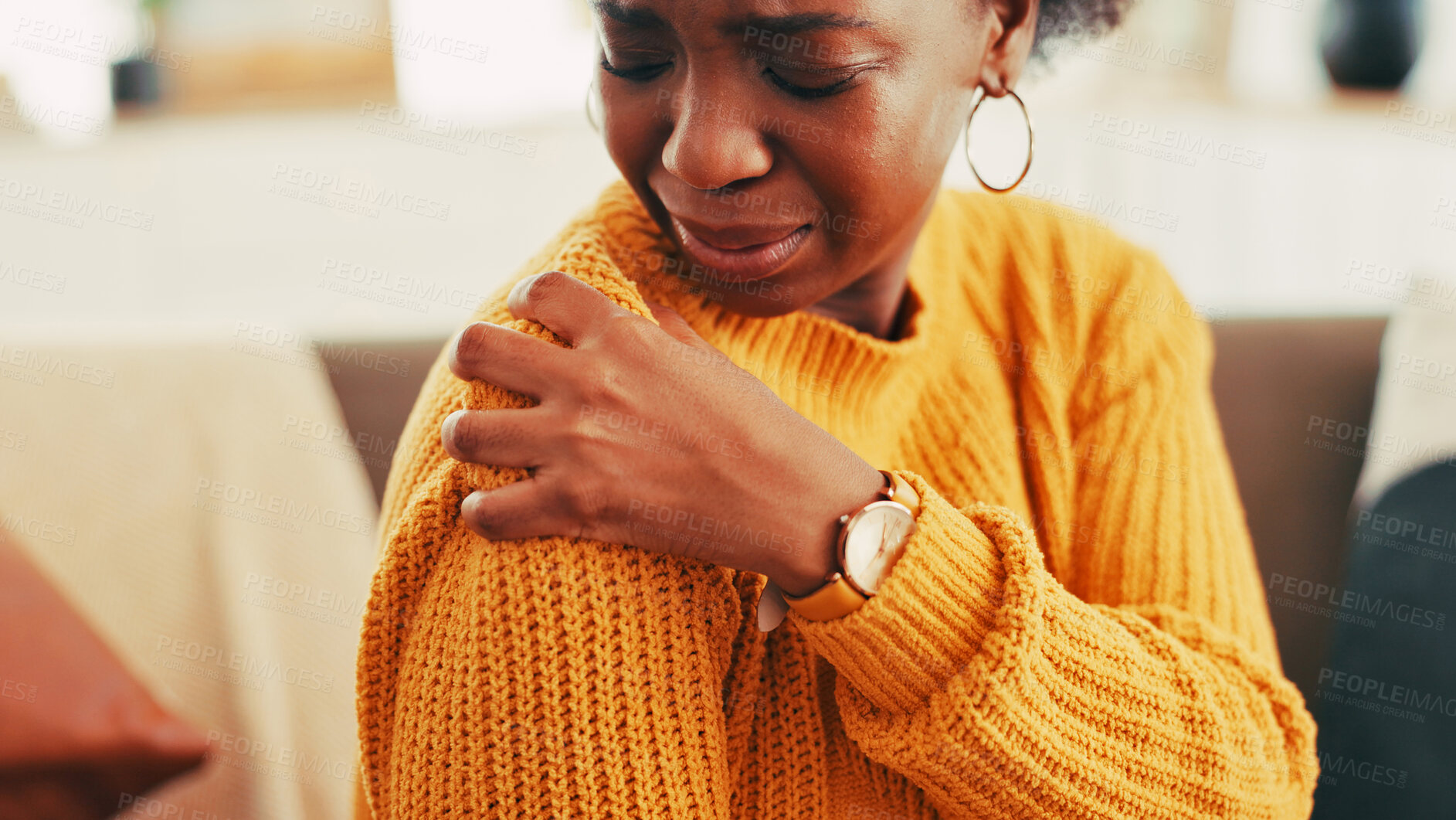 Buy stock photo Hands, woman and shoulder pain on couch at house for discomfort, joint inflammation and fibromyalgia. African person, cramps and muscle tension of arthritis, posture injury and strain of arm fracture
