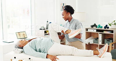 Buy stock photo Stretching legs, senior woman and physiotherapist with help, healthcare or healing. Clinic, physical therapy and person in rehabilitation, injury recovery or exercise with medical support for fitness