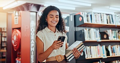 Buy stock photo Smile, woman and student with phone in library for social media, reading chat and university app. Female person, walk and mobile for learning agenda, scholarship application and studying notification