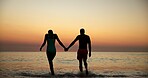 Sunset, back and couple holding hands on beach of summer vacation, tropical journey and romantic. People, shadow and water with adventure, ocean travel and relationship commitment for getaway holiday