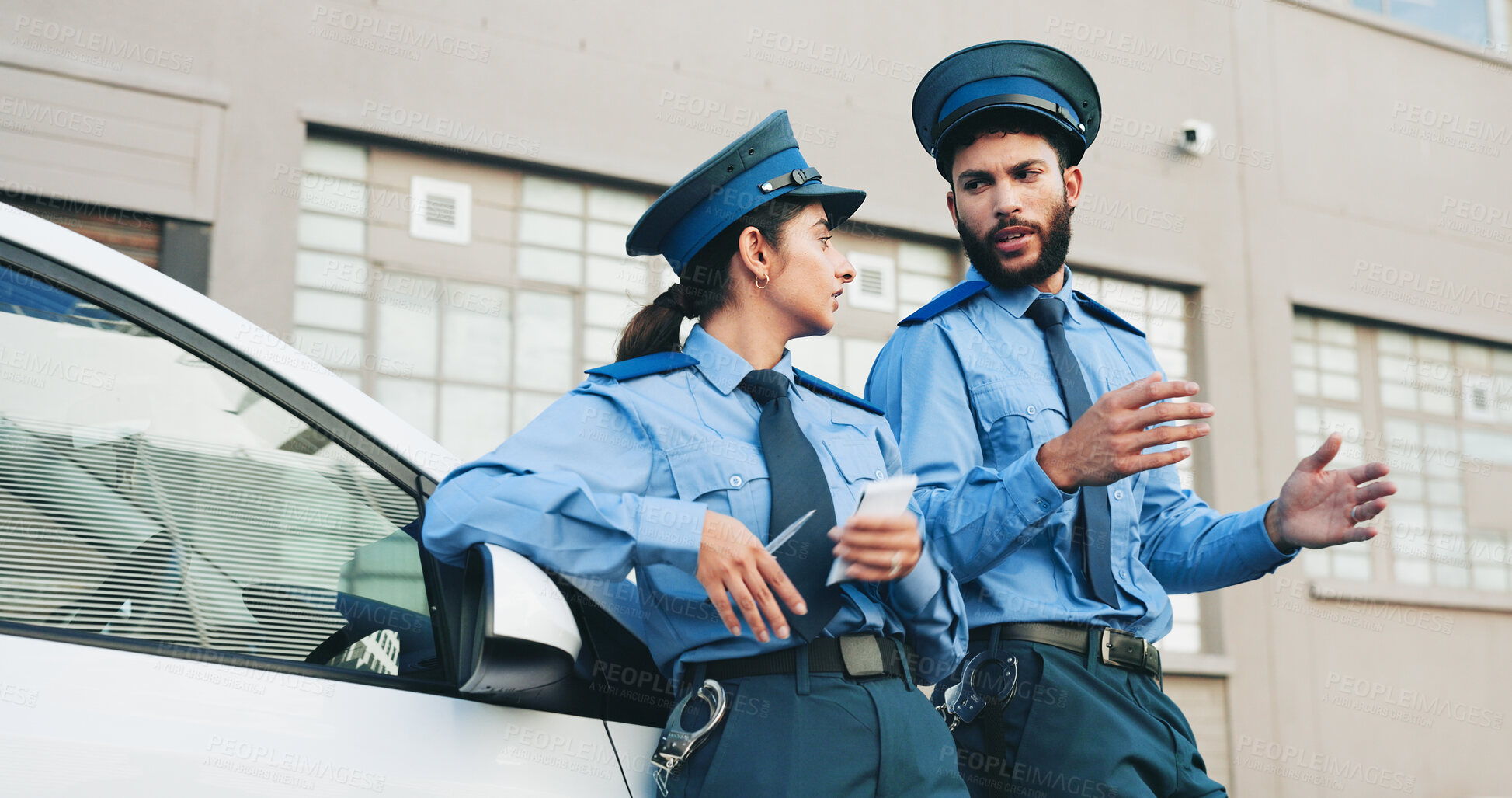 Buy stock photo Man, woman and traffic officer in street with talk, car and outdoor in city with law enforcement career. People, police and discussion for safety services, patrol vehicle or road with partner in town
