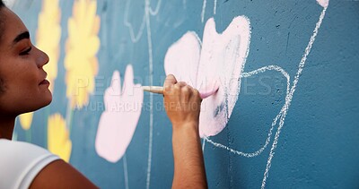 Buy stock photo Woman, hand or painting on wall art for creativity, mural or community service at building. Artist, paintbrush or outdoor with color for floral decor, creative process or flowers for aesthetic design
