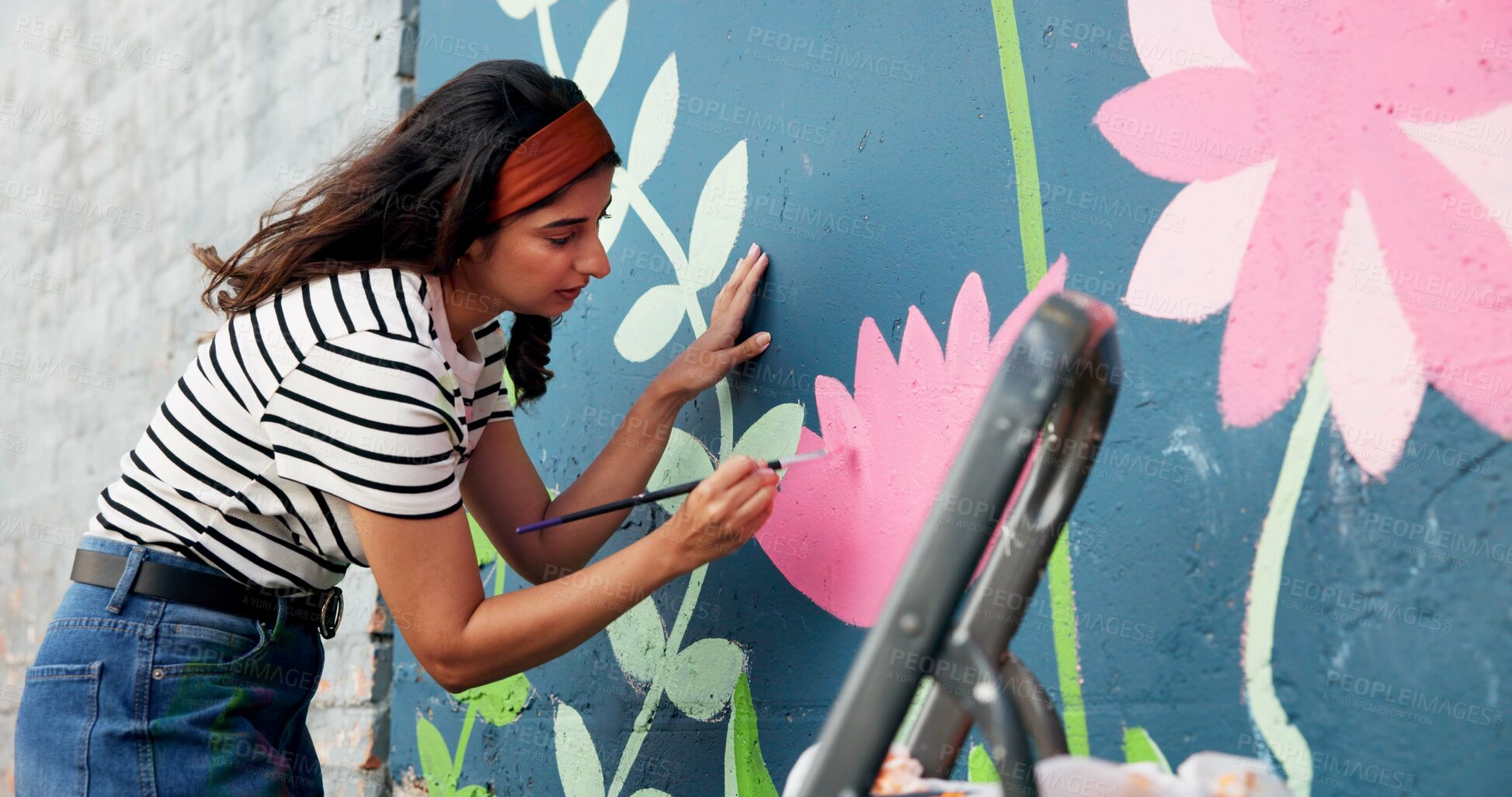 Buy stock photo Artist, woman and painting mural on wall for sustainable awareness, environmental activism or creative project. Flower art, volunteer or floral aesthetic for eco friendly design and earth day outdoor