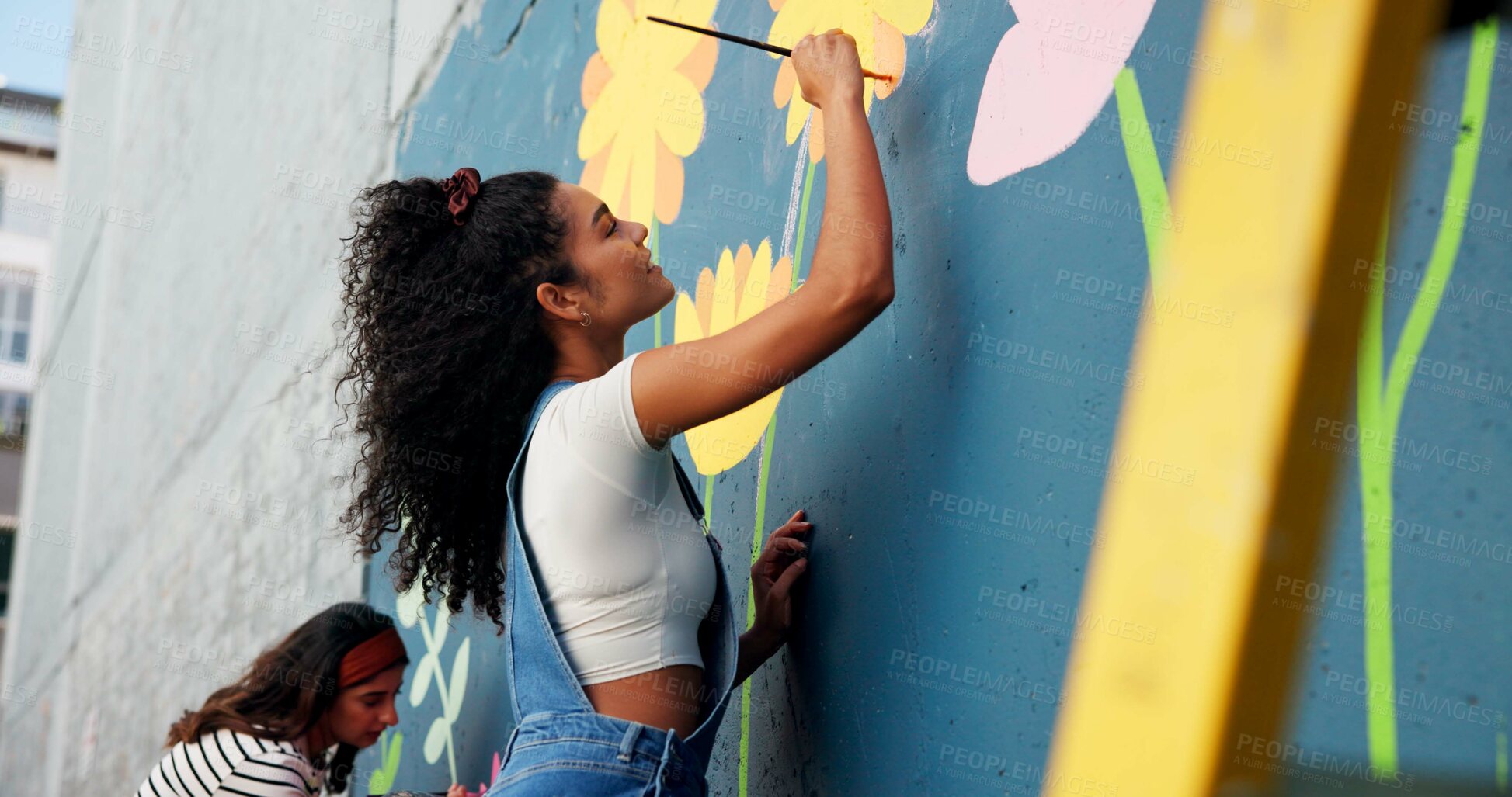 Buy stock photo People, wall painting and women with volunteering, design and teamwork for community project. Activist, artist and friends with creativity, mural and social responsibility with renovation and process