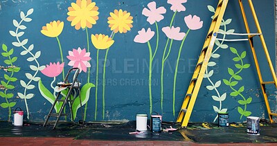 Buy stock photo DIY, ladder and painting with mural on wall in street for decoration, improvement or renovation. Creative, background and flowers outdoor for community art project, design or neighborhood upliftment