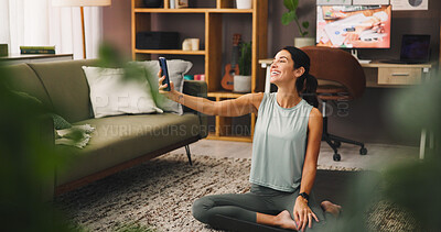 Buy stock photo Selfie, woman and house with fitness break for social media post, photography or memory in lounge. Health blog, exercise influencer and person at home for content creation with smile for picture