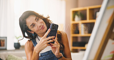 Buy stock photo Creative, woman and picture of painting, smartphone and promotion of artwork, artist or social media. Photography, painter and mature person with mobile for post, online or talent for canvas in house