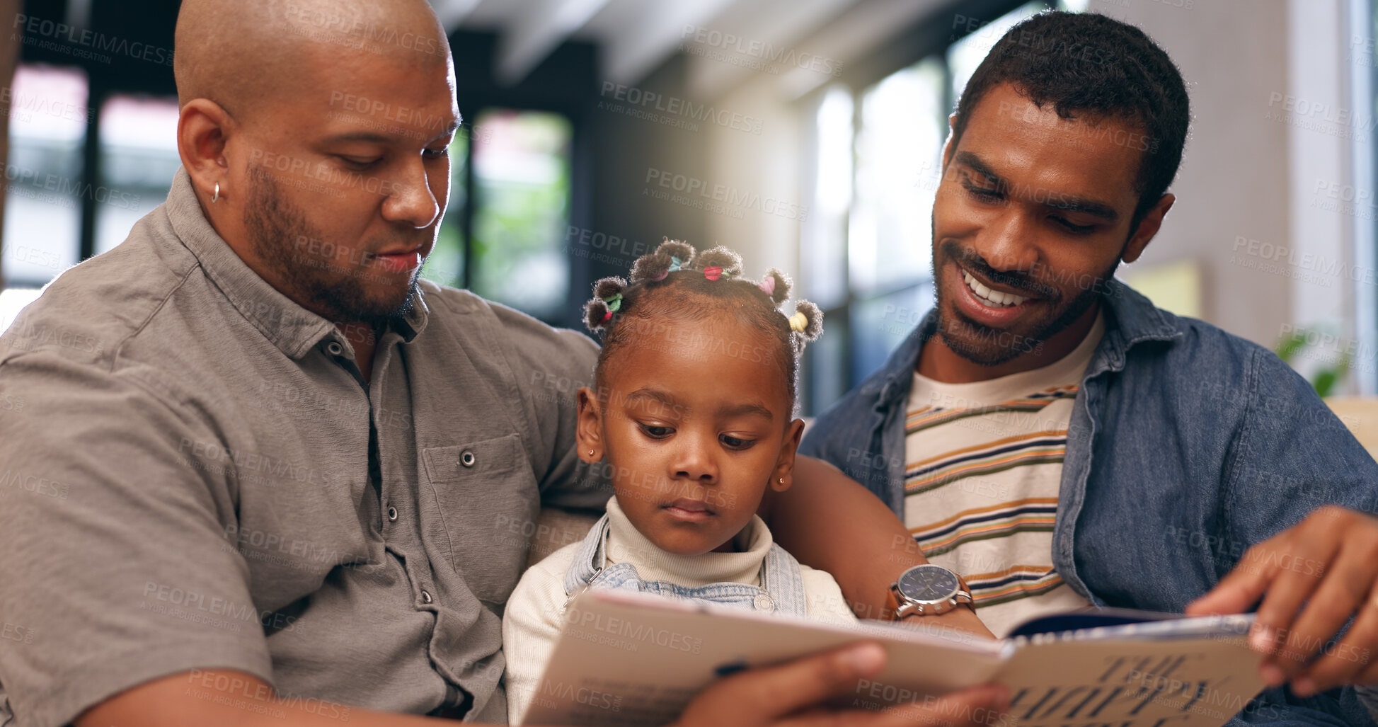 Buy stock photo Book, men and gay couple with kid on sofa, bonding together and learning with knowledge. Home, read and parents with adoption, daughter and storytelling with child development, relationship or relax