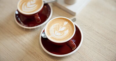 Buy stock photo Cafe, drinks and above of coffee on counter for serving caffeine beverage, espresso and latte art. Hospitality, small business and cappuccino mug with foam on table for restaurant, diner and service