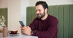Man, smile and phone in coffee shop for message, social media or typing in dating app. Male customer, cafe and smartphone for connectivity, communication or online networking site for weekend break