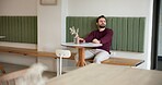 Thinking, waiting and relax with man in cafe for customer service, lunch order and date. Hospitality, reflection and late appointment with person in coffee shop for vision, cafeteria  and restaurant