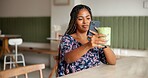 Post, woman and photography with green juice in cafe for social media app, wellness blog and online review. Influencer, african person and picture with organic smoothie in restaurant for detox update