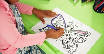 Buy stock photo Color, butterfly and drawing with hands in classroom for child development, artwork and creative project. Above, academy and growth with student at school for knowledge, learning and education
