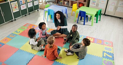 Buy stock photo Singing, learning and teacher with children in classroom for education growth, nursery rhyme or creative. Above, kindergarten or academy with woman and kids at school for helping or child development