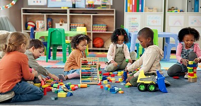 Buy stock photo Kids, students and play with blocks in classroom for learning, problem solving and creative activity. Children, toys and floor for education game, puzzle solution and motor growth in kindergarden