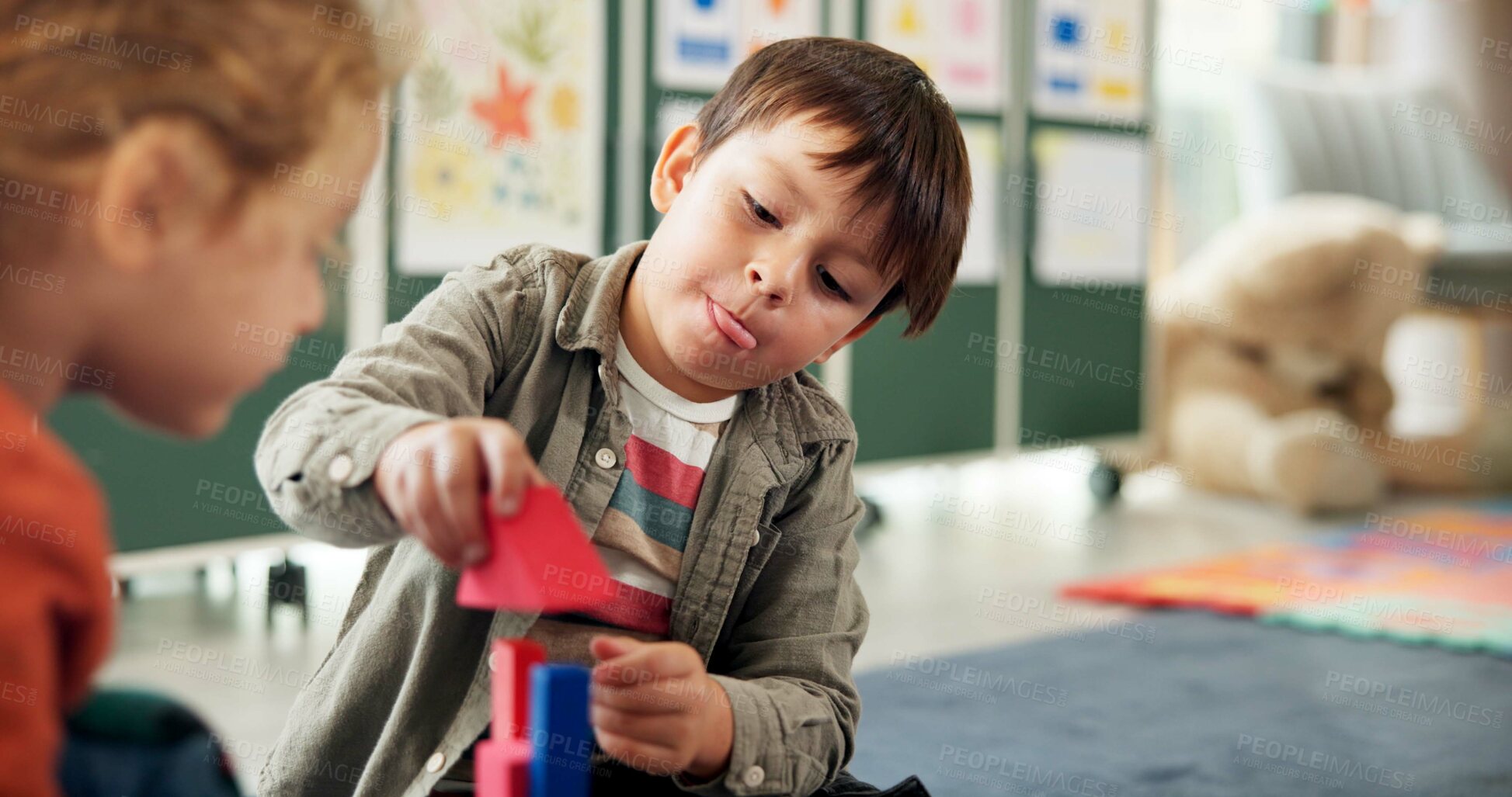 Buy stock photo Education, boy and playing with building blocks in classroom for creative activity, development or gross motor skills. Learning, kid student or stack toys at kindergarten for coordination or solution