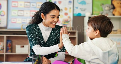 Buy stock photo Education, teacher and child with high five in classroom for learning support, assessment success and progress pride. Happy, people and celebration at academy for development, achievement and study