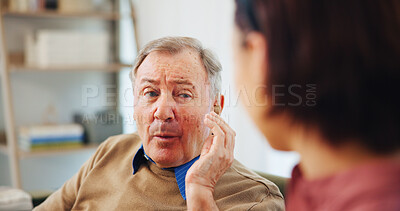 Buy stock photo Consultation, hearing aid and senior man with nurse for tinnitus checkup in nursing home. Talking, healthcare and deaf elderly male patient with caregiver for audiology medical device in house.