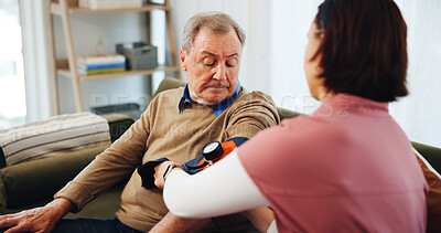 Buy stock photo House, blood pressure and man with caregiver, testing or helping in apartment living room. Senior care, nurse or doctor with patient, trust or support for consulting elderly person or medical service