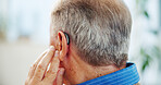 Hearing, medical and nurse with senior man in nursing home for consultation with medical support. Deaf, healthcare and caregiver with elderly male patient for audiology implant in living room.