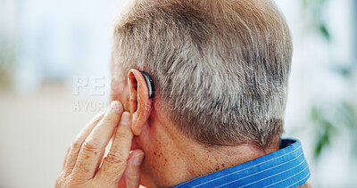Buy stock photo Hearing, hand and ear of senior man in nursing home for medical support with insurance. Deaf, healthcare and closeup back of elderly male patient with audiology implant in living room at house.