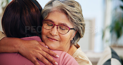 Buy stock photo Hug, gratitude and support with old woman and daughter in home, family for love and bonding for comfort in living room. Peace, trust and embrace with senior mom, female person and together at house