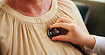Hands, caregiver and stethoscope with senior woman of medical exam, symptoms and listen to heartbeat. Elderly person, nurse and chest assessment for breathing, monitor heart rate and asthma at house