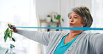 Senior woman, stretching and band for fitness with physical therapy, mobility exercise or rehabilitation. Elderly person, equipment or training for physiotherapy, medical recovery and joint treatment