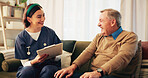 Nurse, talking and senior man with clipboard for assisted living, medical service and help in nursing home. Retirement, healthcare and caregiver with elderly person for consulting, support and notes