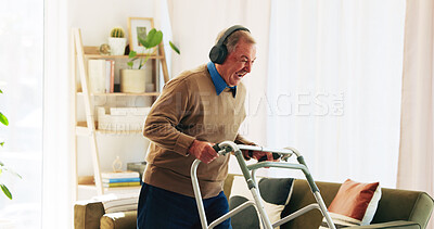 Buy stock photo Headphones, walking frame and senior man in home listening to radio, audio and song for fun. Retirement, excited and elderly person with disability and energy for music, track and dance in house