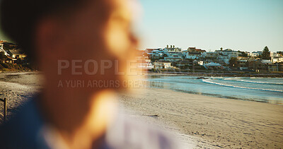 Buy stock photo Person, ocean and beach with buildings for holiday getaway, vacation or view by coast in nature. Tourist, travel or commute with water, architecture or neighborhood for outdoor destination by shore