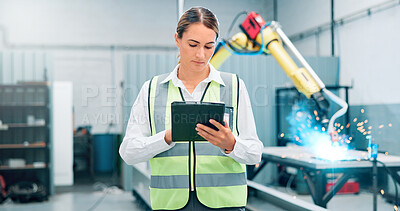 Buy stock photo Engineer, tablet and woman with robot arm for welding, ai machine and manufacturing in factory. High tech, automation and worker with production process, industry 4.0 and cnc software for innovation