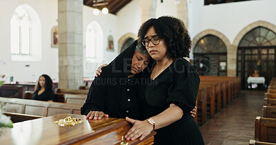 Buy stock photo Sad, hug and family with support in funeral for farewell service, mourning death or grief. Respect, women or people with casket or empathy in Christian cathedral for burial, ceremony and memorial
