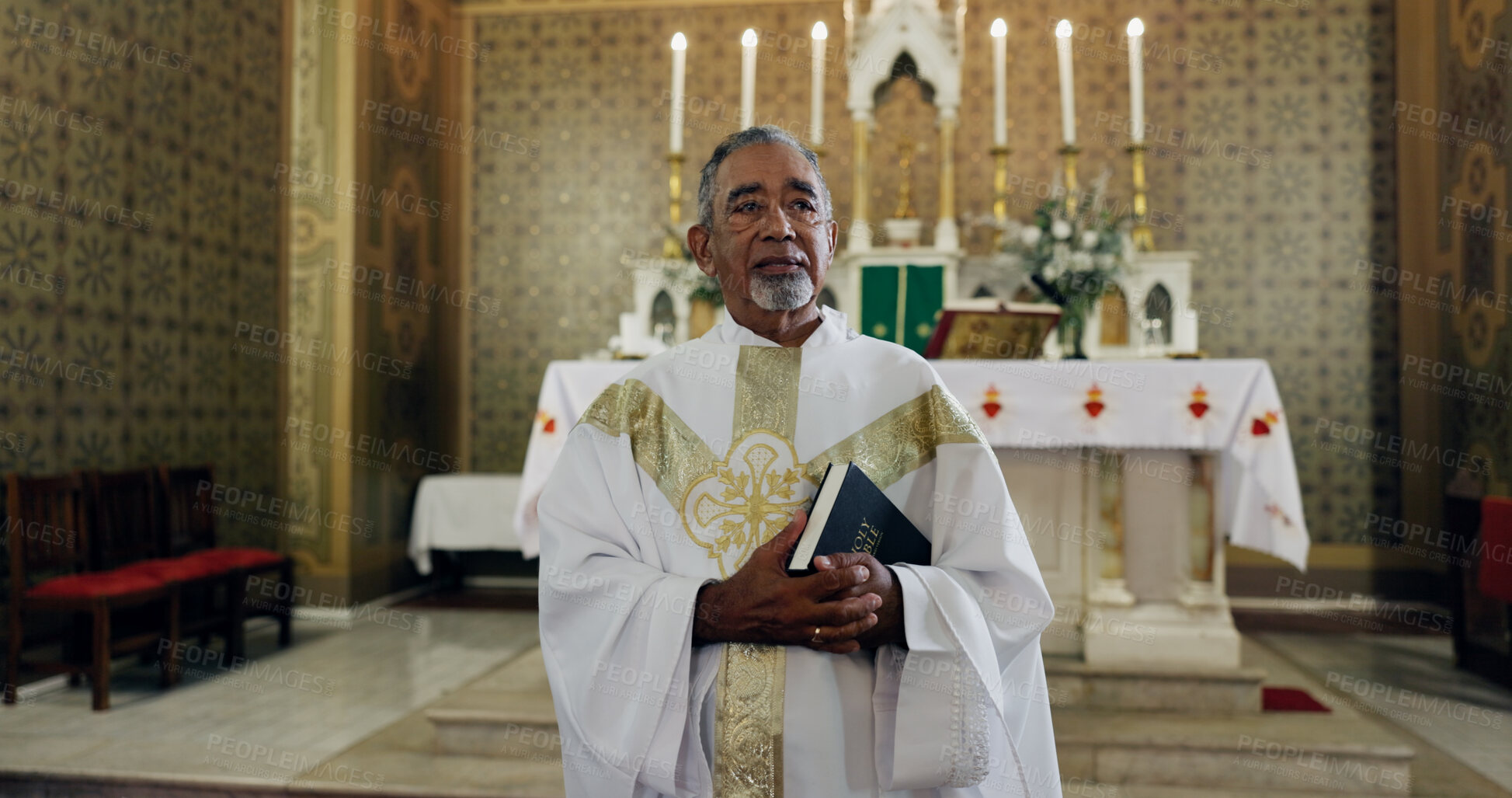 Buy stock photo Church, priest and man with bible, gospel and preacher with book for sermon, holy or spiritual. Worship, God and mature person with faith for ceremony, catholic and prayer with belief or Christianity