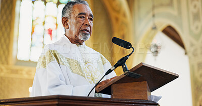 Buy stock photo Christianity, pastor and praying in church, stage and preaching with microphone for faith and gospel. Podium, preacher and mature man with speech for religion, Easter service or sermon to worship God