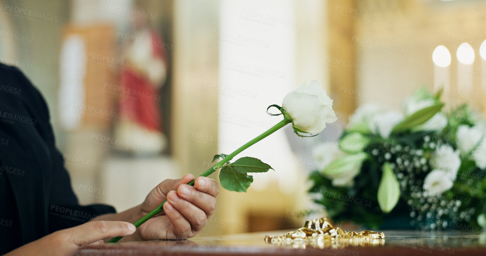 Buy stock photo Funeral, hand or woman with flower with coffin in church for farewell service, mourning death or grief. Respect, goodbye or person with casket or rose in cathedral for burial, support or memorial