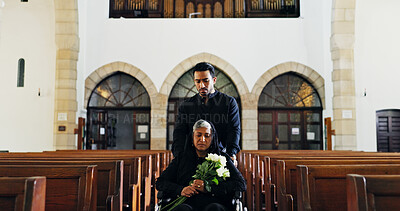 Buy stock photo Wheelchair, people and sad in church, funeral and family with grief for faith, son and widow with flowers. Christianity, mourning and senior woman with disability, memorial service and depression