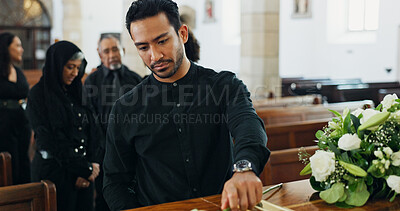 Buy stock photo Sad, man and rose at funeral for farewell service, mourning death and goodbye at burial ceremony. Male person, flowers and respect with rip, loss memorial and emotional gathering at community church