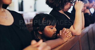 Buy stock photo Religion, praying and kid in church with family for memorial, burial or funeral service. Worship, spiritual guidance and girl child with prayer for hope, faith or respect with gospel in chapel.